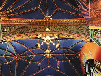 Low angle view of ornate ceiling at temple