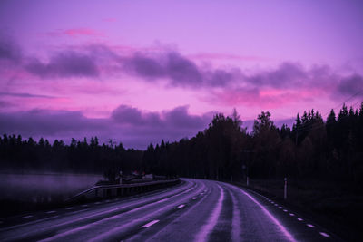 Panoramic view of road against sky at sunset