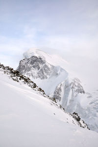 Scenic view of snowcapped mountain against sky