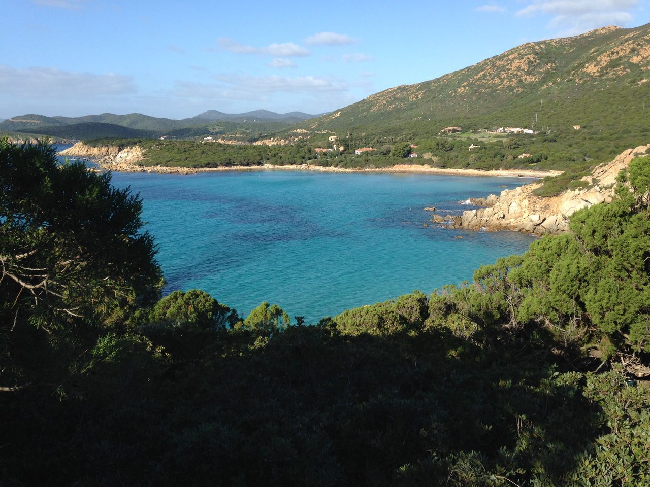 mountain, water, sea, tranquil scene, scenics, tranquility, beauty in nature, mountain range, nature, sky, coastline, tree, idyllic, blue, beach, high angle view, shore, lake, outdoors, day