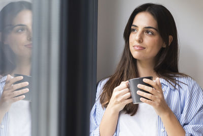 Young woman using mobile phone