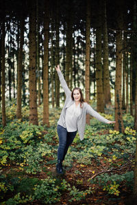 Portrait of young woman in forest