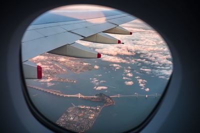 Aerial view of san franciscooakland bay bridge seen from airplane window