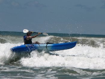 People surfing in sea