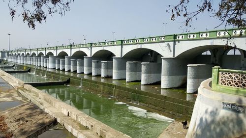 Bridge over river against clear sky