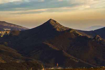 Scenic view of mountains against sky during sunset