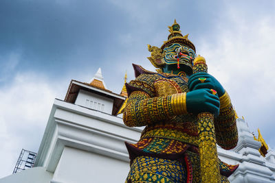 Low angle view of statue against building