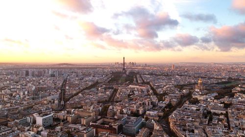 High angle view of cityscape against cloudy sky