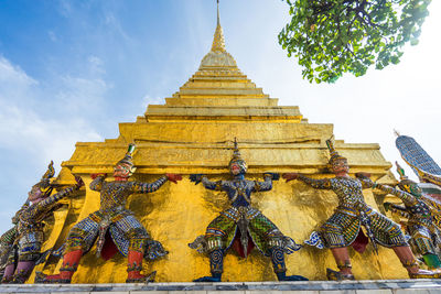 Statue of temple against building