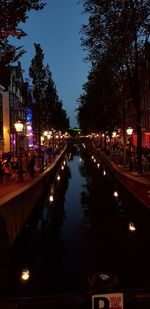 Reflection of illuminated buildings in canal at night