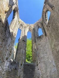 Low angle view of old ruins against sky