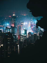 Silhouette of illuminated buildings at night