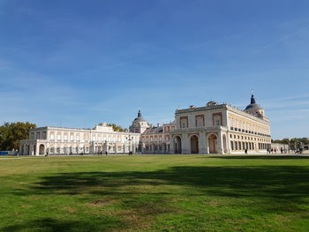 Facade of historic building against blue sky