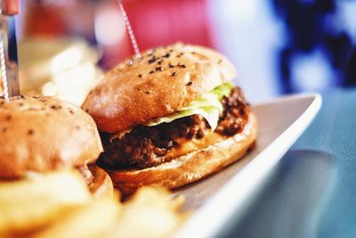 Close-up of burgers in plate on table