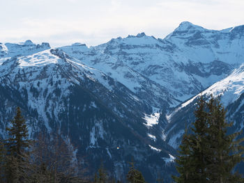 Scenic view of snowcapped mountains against sky