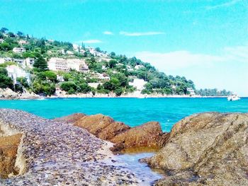 Scenic view of sea against blue sky