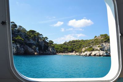 Scenic view of sea seen through window