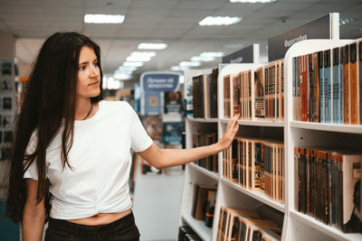 Woman standing on a book