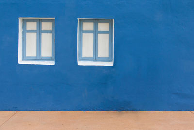 White painted window on wall of building