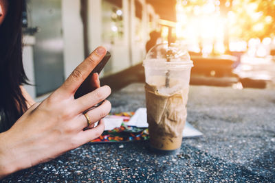Midsection of woman holding ice cream cone