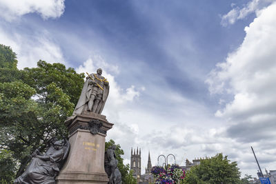 Low angle view of statue against sky