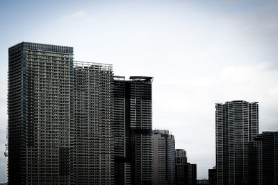 Skyscrapers in city against sky