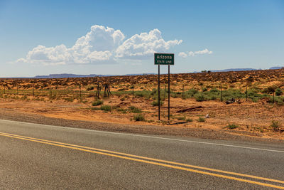 Arizona state line sign in the landscape near monument valley