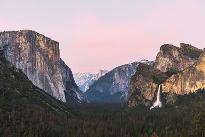 Scenic view of rocky mountains against sky during sunset