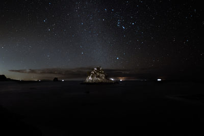 Scenic view of sea against sky at night