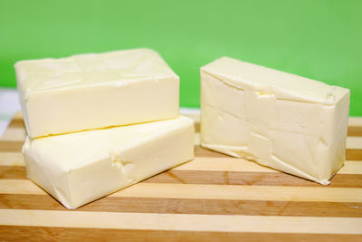 Close-up of coffee cup on cutting board