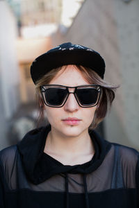 Portrait of young woman wearing sunglasses