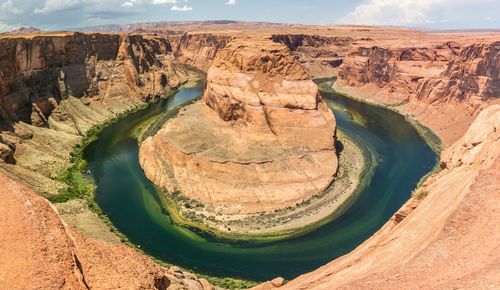 Scenic view of rock formations at riverbank