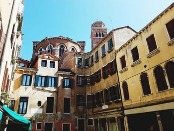Low angle view of buildings against clear sky