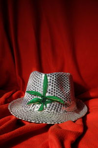 White hat on red textile