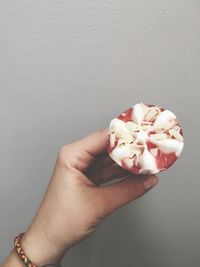 Close-up of hand holding ice cream