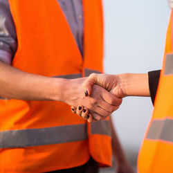 Close-up of engineers shaking hands