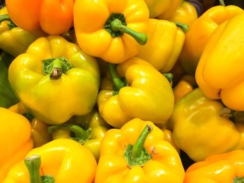 Full frame shot of yellow bell peppers for sale in market