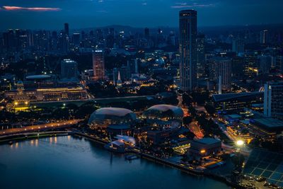 High angle view of illuminated city buildings at night