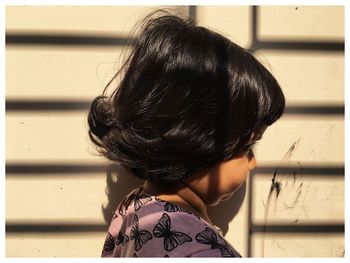 Rear view of girl standing outdoors