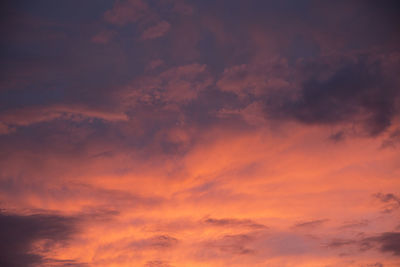 Low angle view of cloudy sky at sunset