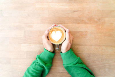 High angle view of coffee cup on table