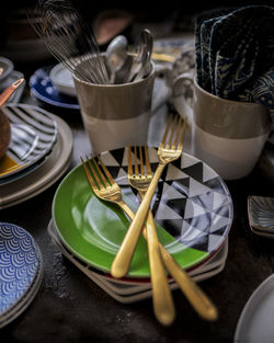 Close-up of forks in plate on table