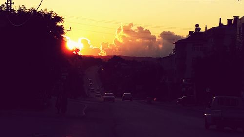 Silhouette of built structures at sunset