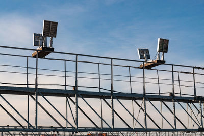 Low angle view of bridge against sky in city