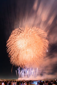 Firework display at night