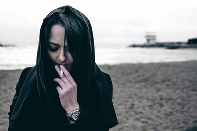 Woman standing at beach