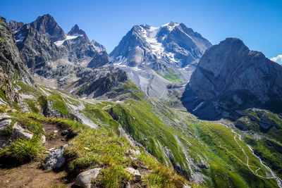 Scenic view of snowcapped mountains against clear sky