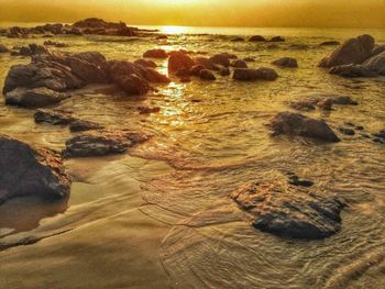 Scenic view of sea at sunset