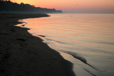 Scenic view of lake ontario against clear sky during sunset