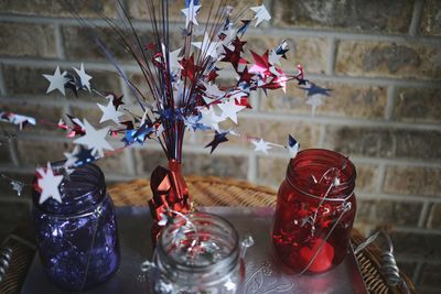 Close-up of decorations and jars on table